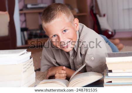 Young boy doing his homework at home - education