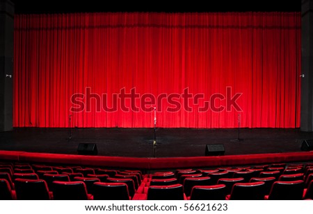 Stage red curtains over wooden floor