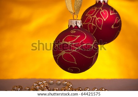 red christmas decorations - yellow light in  background
