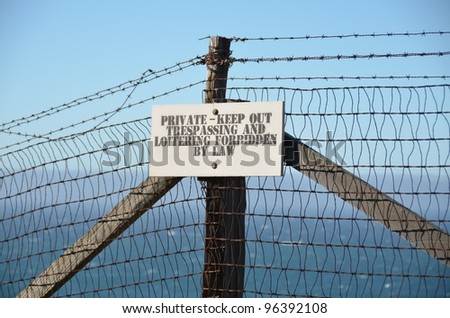 private property sign at a fence wants to keep out people