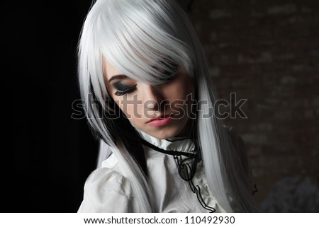 cute young woman with white hair and black nails