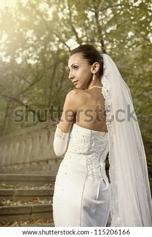 Wedding portrait of beautiful young bride outdoor