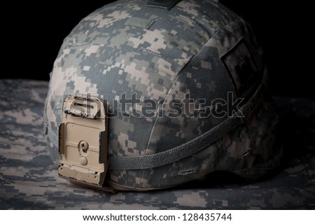 US Army Helmet in low key on black background