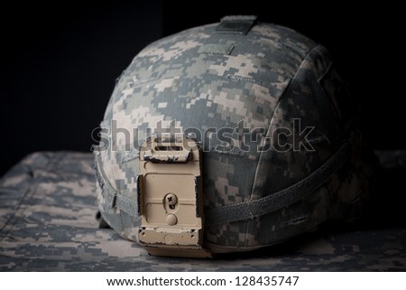 US Army Helmet in low key on black background