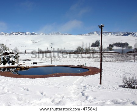 Swimming pool surrounded by snow