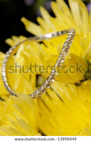 A diamond bracelet on yellow flowers