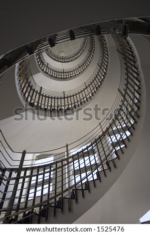 A shot of a spiral staircase from the bottom