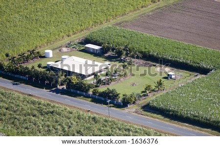 Aerial of sugar cane farm house in Queensland, Australia.