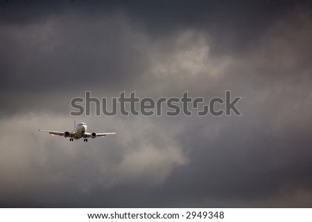 An aircraft on final approach moments before a storm breaks.