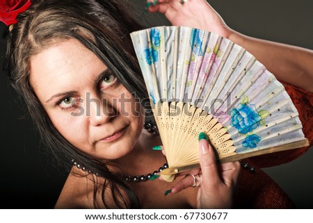 woman in red with fan