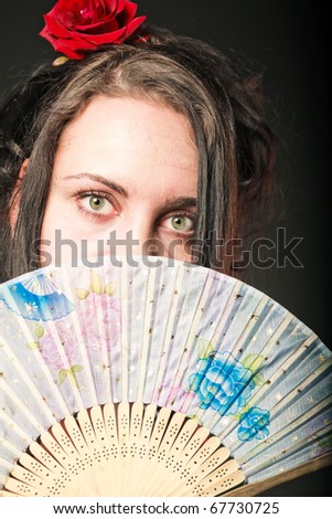 woman in red with fan