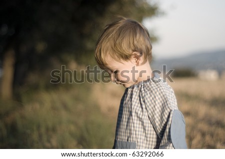 Boy with kinder garden overall