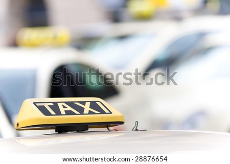 Taxi sign on a car with a shallow depth of field