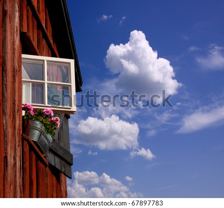 Open your window.  An open window, blue sky with clouds.
