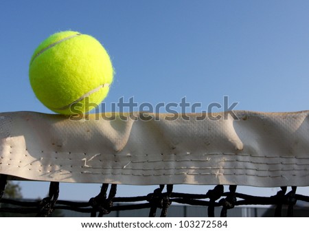 Tennis Ball on the Court Net with room for copy