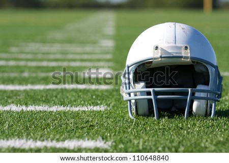 American Football Helmet on the Field with room for copy