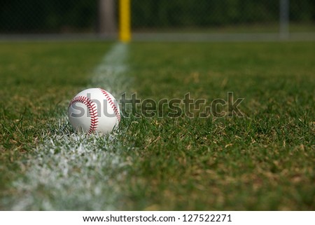 Baseball on the Outfield Chalk Line with room for copy