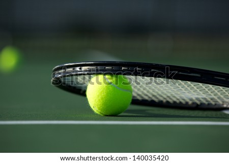 Tennis Ball and Racket on the Court with room for copy