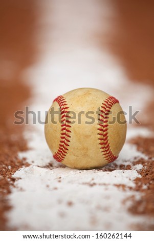 Worn Baseball on the Infield Chalk Line