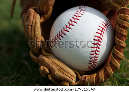 New Baseball in a Glove Close Up