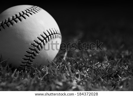 New Baseball Close Up in the Outfield Grass with room for Copy in Black and White