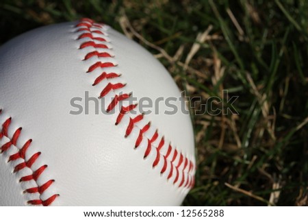 Baseball against grass with room for copy