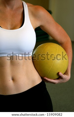 Fit woman holding a medicine ball