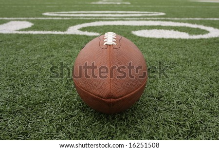 Football near the 50 yard line