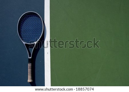 Tennis racquet on the court with room for copy