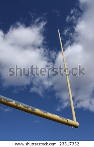 Football goalpost against a cloudy sky