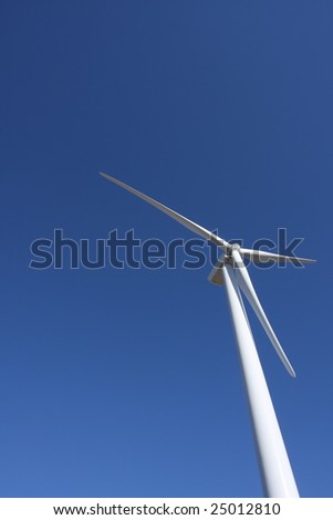Close up of a wind turbine with room for copy