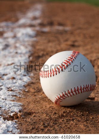New Baseball on the Field near the Chalk Line