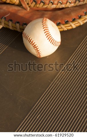Baseball and a Glove on the bench with room for copy