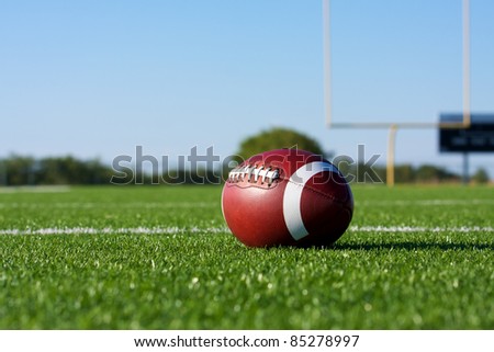 American Football on the Field with the Goal Posts beyond