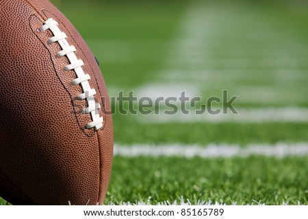 Pro American Football on the Field Close Up with room for copy, shot at shallow depth of field