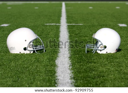 American Football Helmets on the Field with room for copy