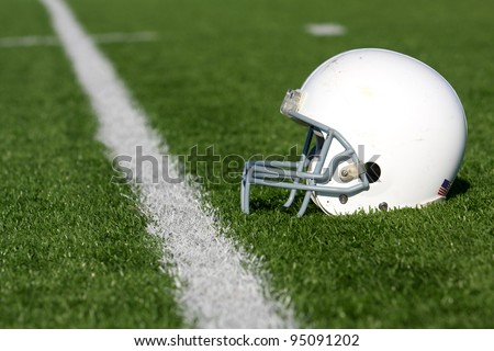 American Football Helmet on the Field with room for copy