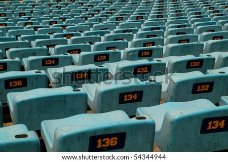 Stadium seats in a sports view showing seat number