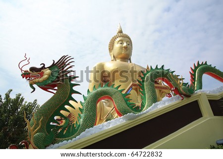 A big golden Buddha Image with the green dragon