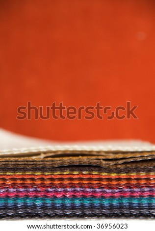 Pile of colorfull leather sheets. Shallow dof. Copy space