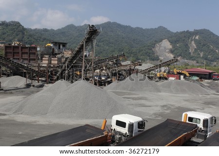 Sand factory includes conveyor belt and sand.