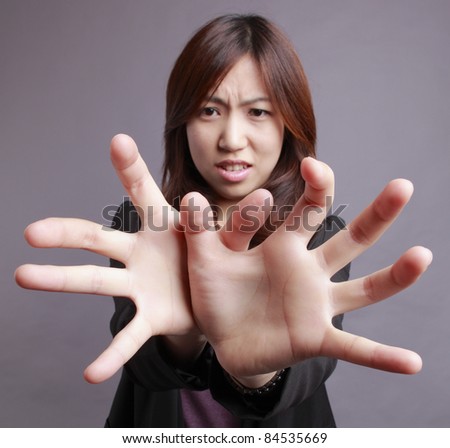 Girl shows her hands in front of lens.