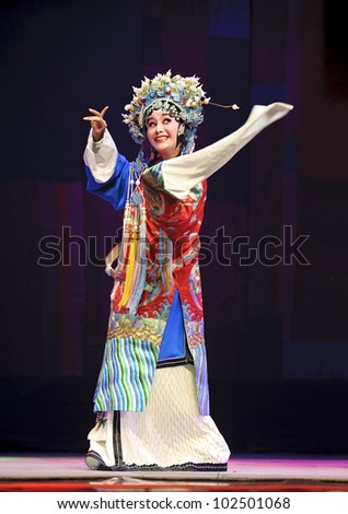 CHENGDU - JUN 8: Chinese Chu opera actress make a show on stage to compete for awards in 25th Chinese Drama Plum Blossom Award competition at Experimental theater.Jun 8, 2011 in Chengdu, China.