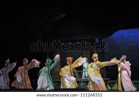 CHENGDU, CHINA - JUNE 3: Chinese Cantonese opera performer make a show on stage to compete for awards in 25th Chinese Drama Plum Blossom Award competition at Jinsha theater on June 3, 2011 in Chengdu, China.