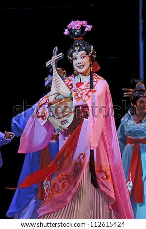 CHENGDU - JUN 6: Chinese Gaojia Opera performer make a show on stage to compete for awards in 25th Chinese Drama Plum Blossom Award competition at Jinsha theater.Jun 6, 2011 in Chengdu, China.