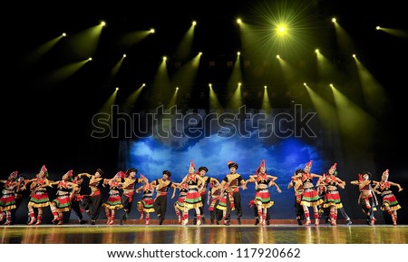 CHENGDU - SEP 26: chinese ethnic dancers of Yi nationality perform on stage at JIAOZI theater.Sep 26,2010 in Chengdu, China.