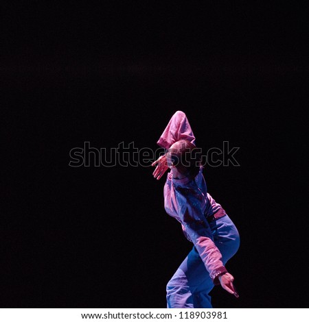 CHENGDU - DEC 11: chinese modern dancer performs solo dance on stage at JINCHENG theater in the 7th national dance competition of china on Dec 11,2007 in Chengdu, China.