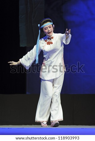 CHENGDU - JUN 8: Chinese Chu opera performer make a show on stage to compete for awards in 25th Chinese Drama Plum Blossom Award competition at Experimental theater.Jun 8, 2011 in Chengdu, China.