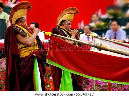 CHENGDU - MAY 23: Lama blow tibetan long horn in the 1st International Festival of the Intangible Cultural Heritage China, on May 23, 2007 in Chengdu, China.