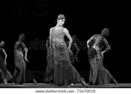 CHENGDU, CHINA - SEPT 28: Chinese Dai ethnic dancer performs on stage in the 6th Sichuan minority nationality culture festival at Jinjiang theater on Sept 28, 2010 in Chengdu, China.
